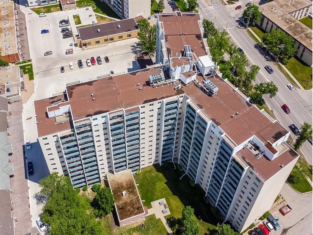 an aerial view of an apartment building in a city