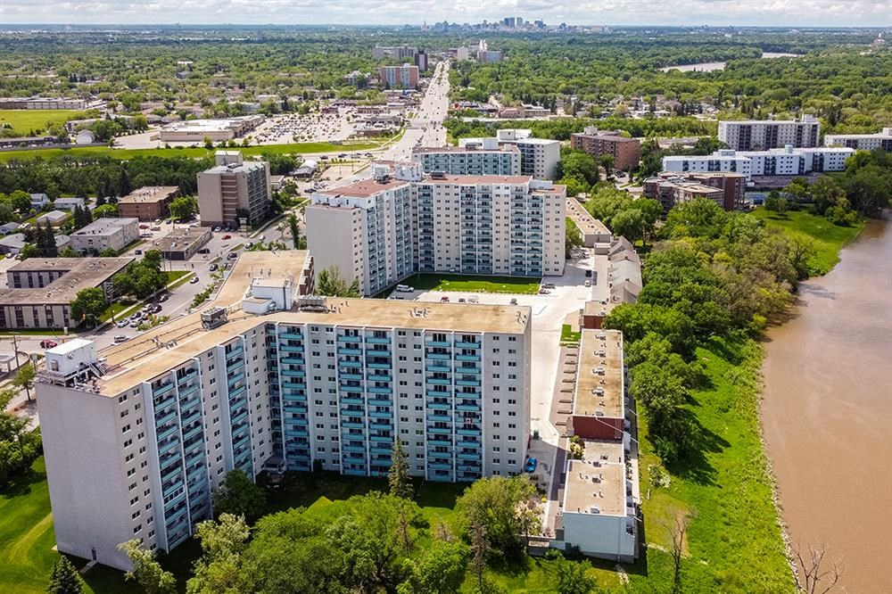 an aerial view of a city with a river and buildings