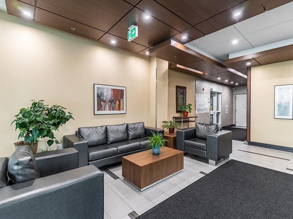 a lobby with couches and a coffee table