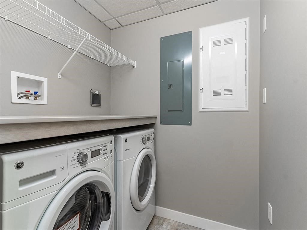 a washer and dryer in a laundry room with a door