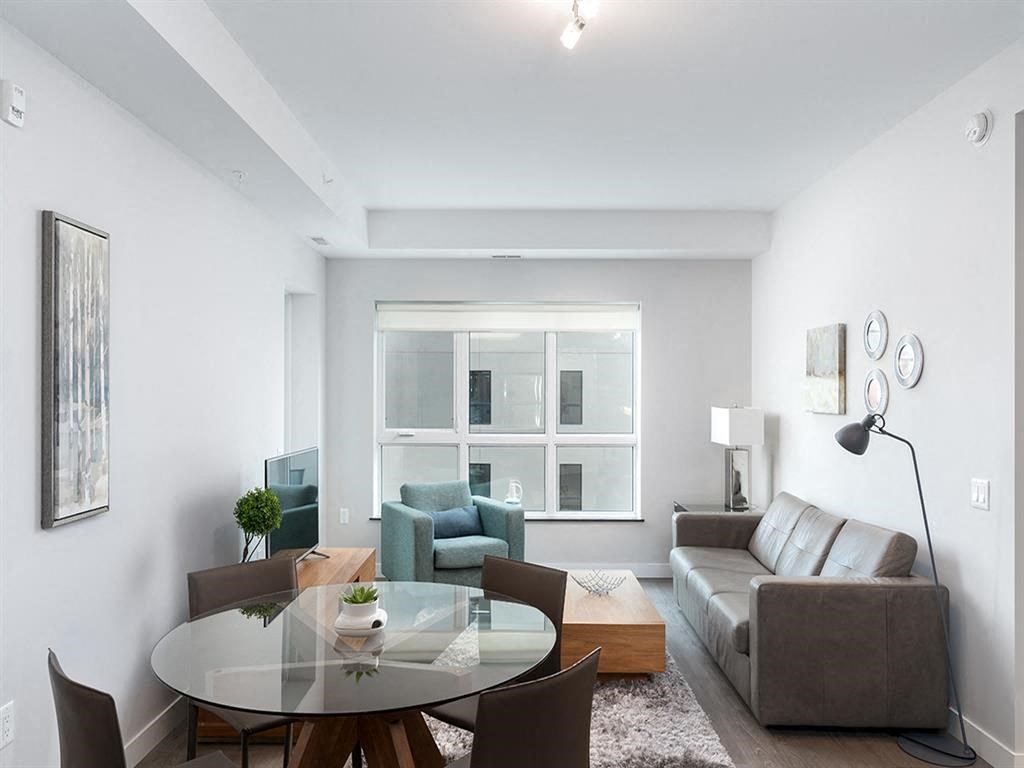 a living room with a couch and a table