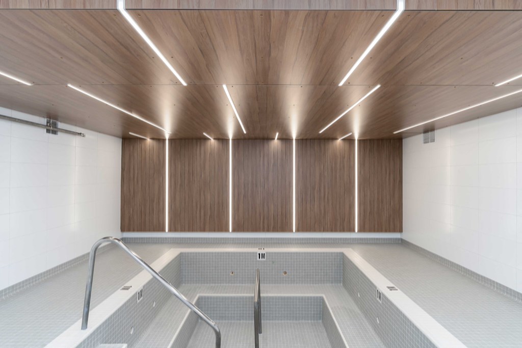 a large room with wooden ceilings and white walls