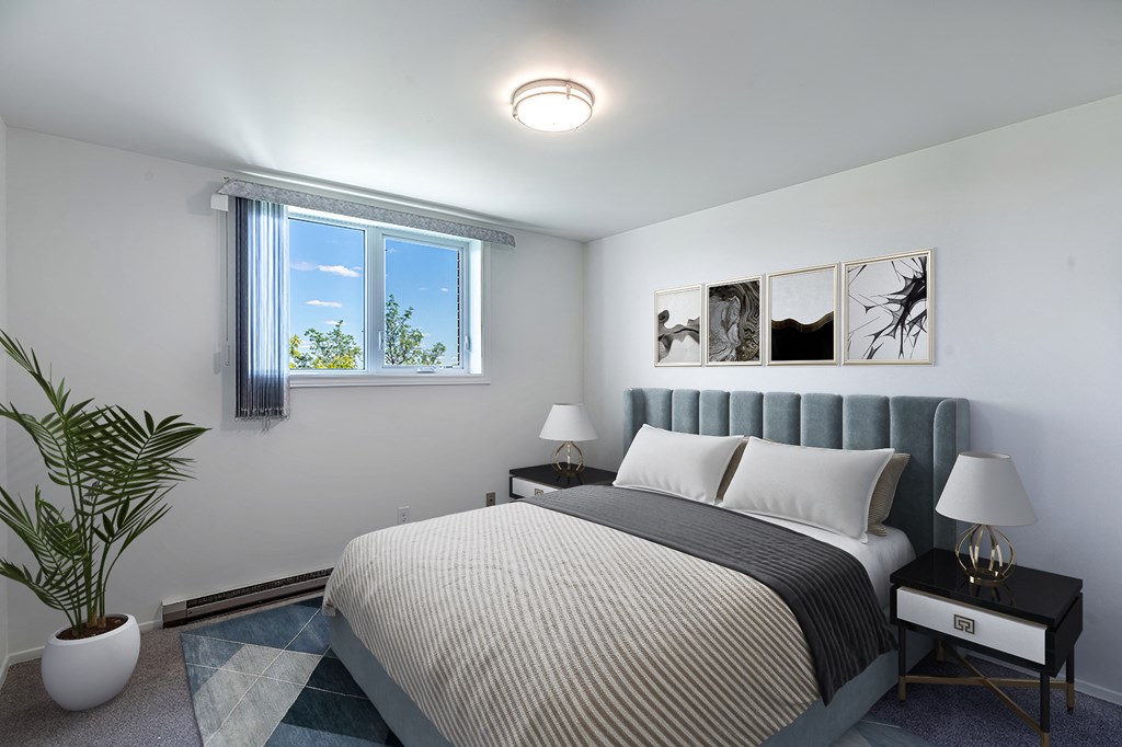 a bedroom with a bed and a window