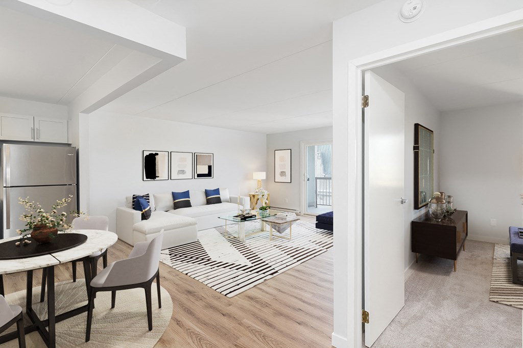 a living room with a white couch and a table