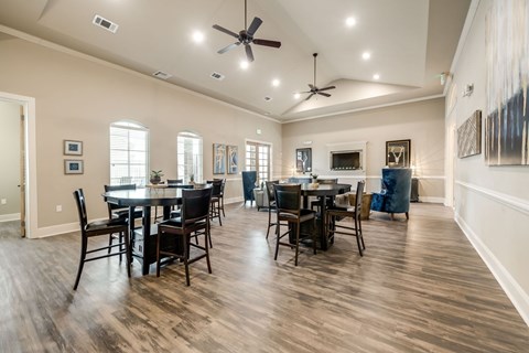 A dining room with a table set for six.