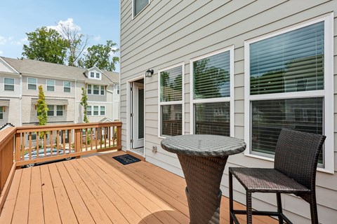 A patio with a table and chairs is shown.