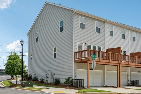 A two story building with a balcony on the second floor.