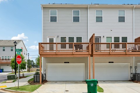 A stop sign is on the corner of a street.