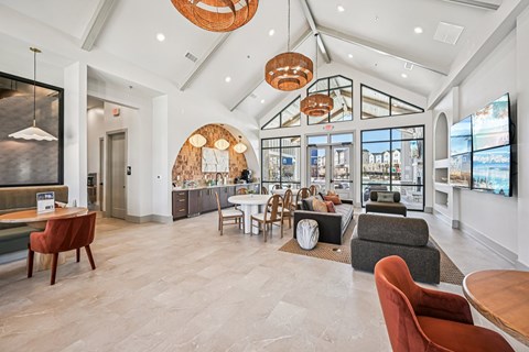 A spacious room with a white ceiling and a large window.