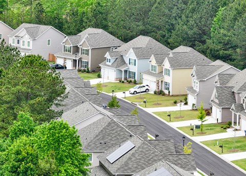 A suburban neighborhood with houses and trees.