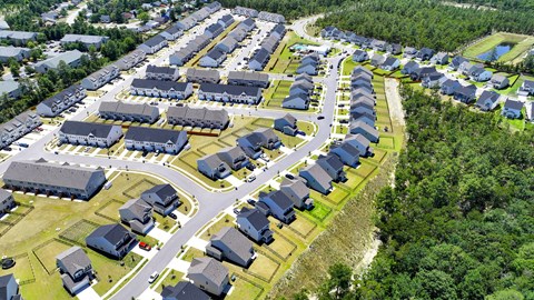 an aerial view of a neighborhood with houses and cars parked