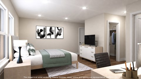 A bedroom with a bed, a chair, a desk, and a television.