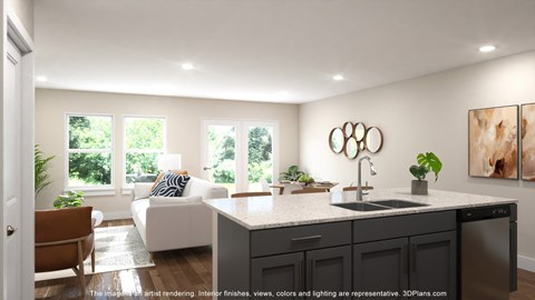 A modern kitchen with a large island and a sink.