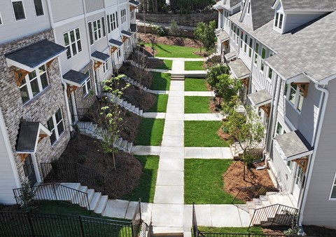 A view of a courtyard between two buildings.