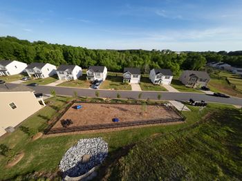 an aerial view of a house in a neighborhood