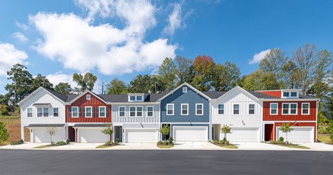 A row of houses with different colored exteriors.