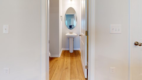 A bathroom with a sink and mirror.