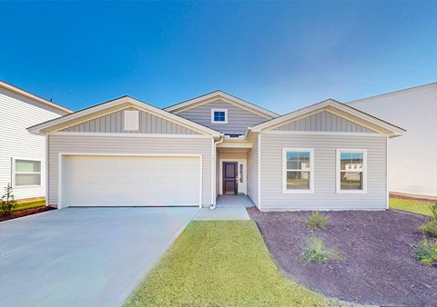 A two-story house with a garage and a driveway.