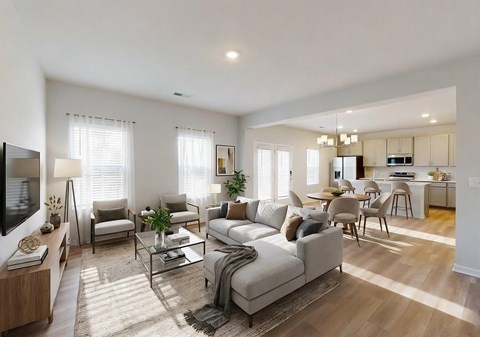 A modern living room with a grey sofa set and a television.