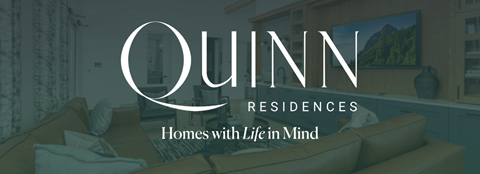 A modern living room with a sofa and a painting on the wall.