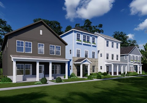 A row of houses with a blue sky in the background.
