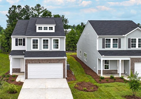 Two houses with garages are shown in the image.