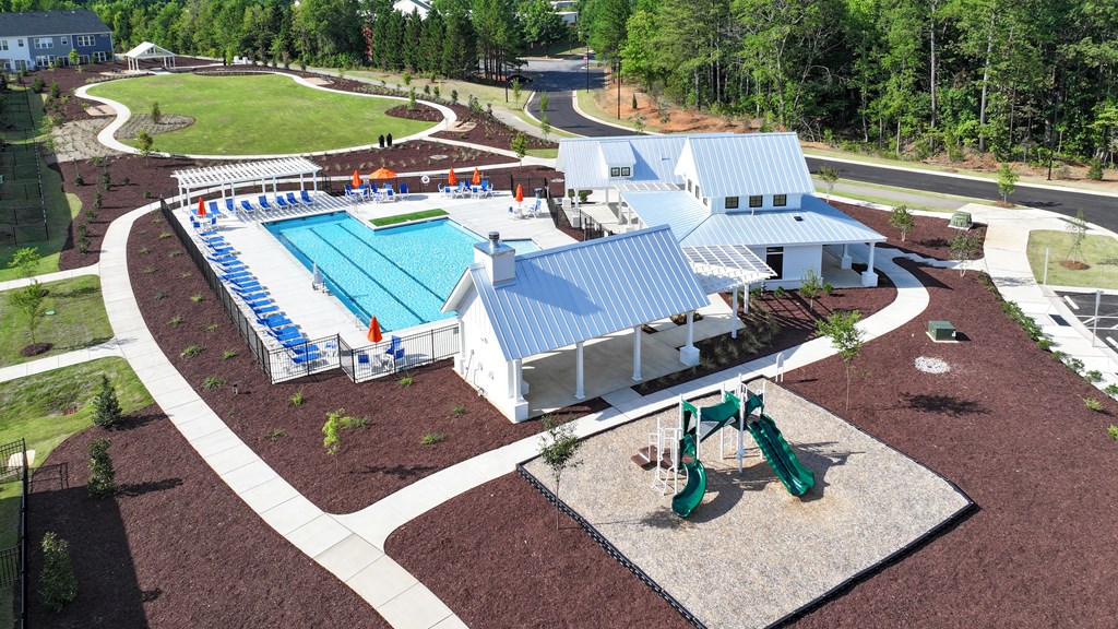 an aerial view of a building with a swimming pool