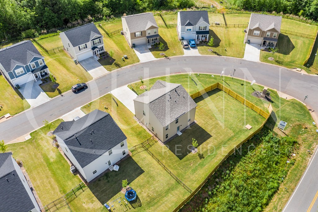 an aerial view of a group of houses in a neighborhood