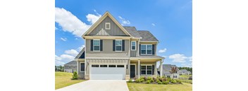 A two-story house with a garage is shown.