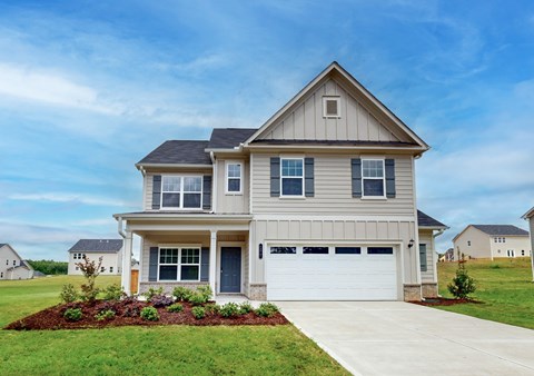 A two-story house with a garage is shown in the image.