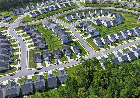 A bird's eye view of a residential neighborhood with houses and streets.