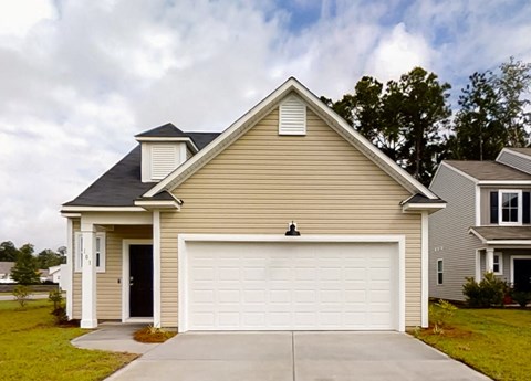 A two-car garage is attached to a house.