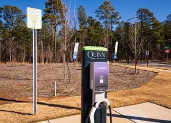 a parking meter in front of a park