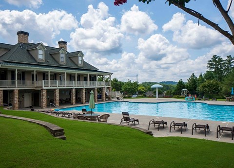 A large house with a pool in the backyard.