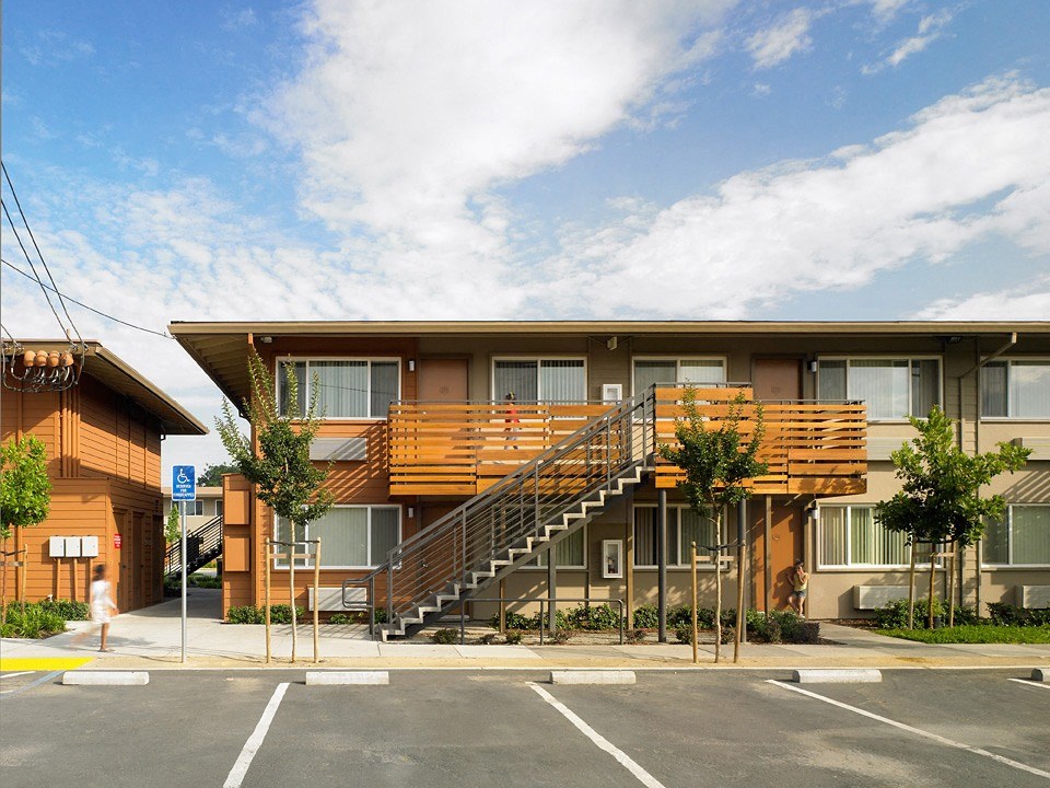 a building with a wooden staircase in front of it