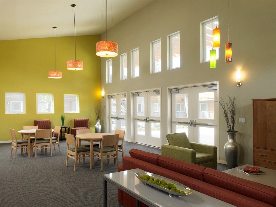 a large room with a table and chairs and a couch