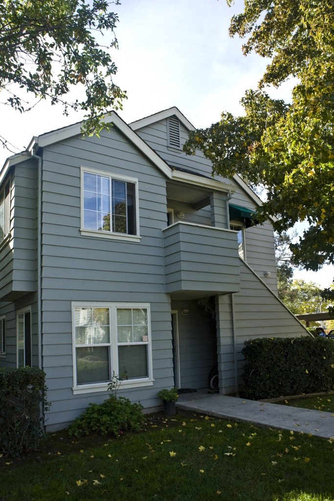 a with a sidewalk in front of it