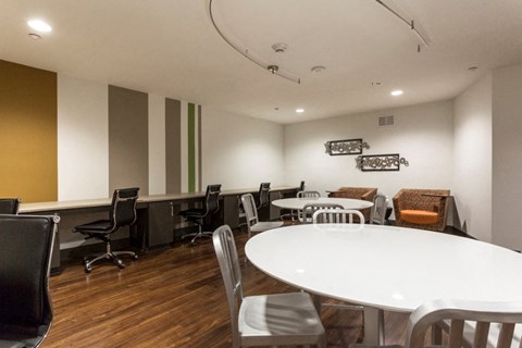 a conference room with a large white table and chairs