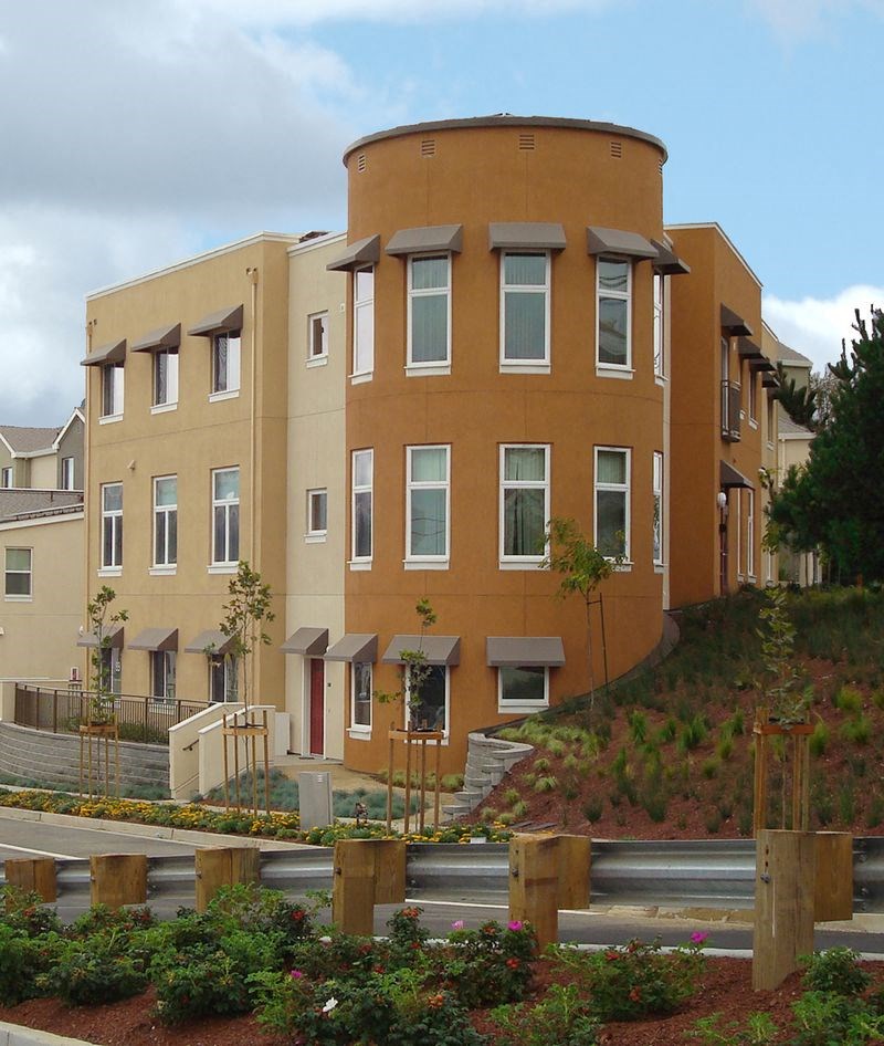 a large building with a hill in front of it
