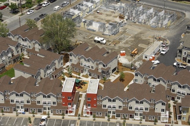 an aerial view of a development of houses in a suburban neighborhood