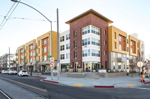 a new apartment building on the corner of a city street