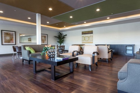 a living room with couches and chairs and a table