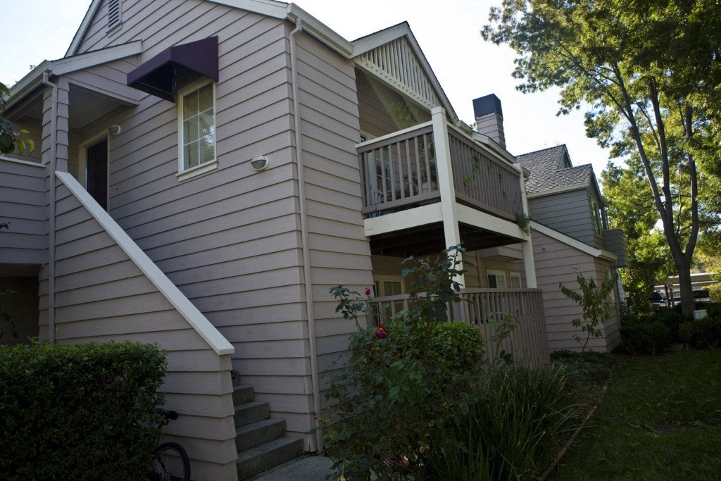 a view of the side of a house with a balcony