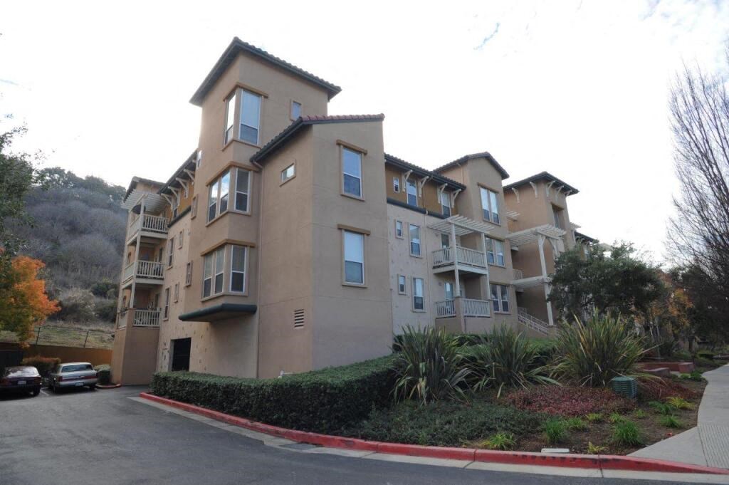 an apartment building on the corner of a street