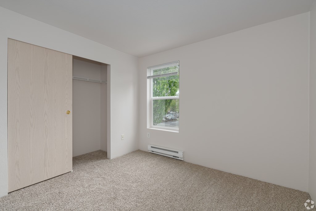 A room with a door and a window.