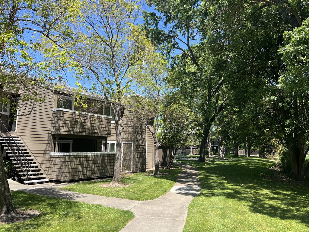A building with a tree in front of it.