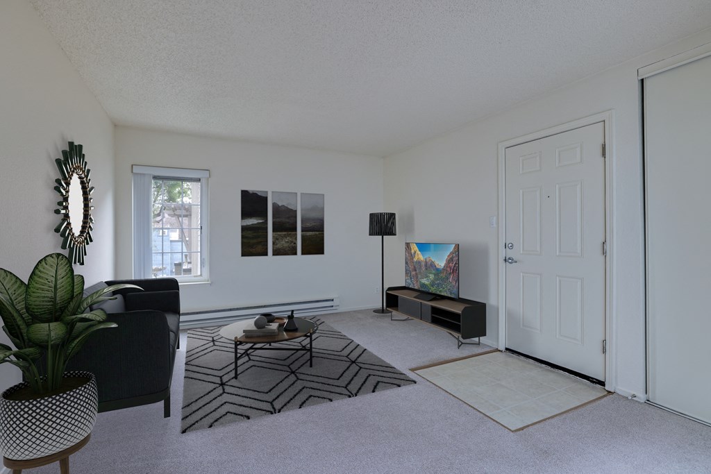 a living room with white walls and a white door