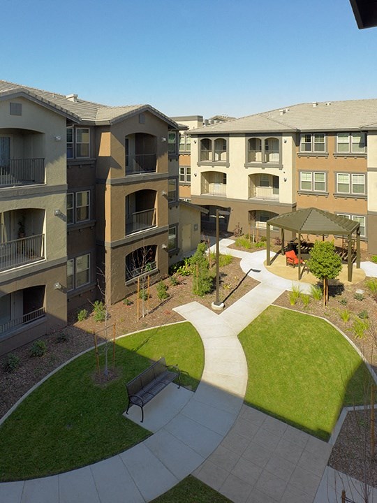 an aerial view of the courtyard of an apartment building