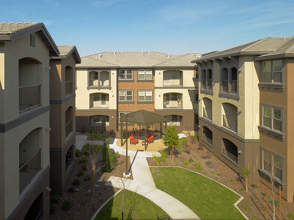 an aerial view of the courtyard of an apartment complex