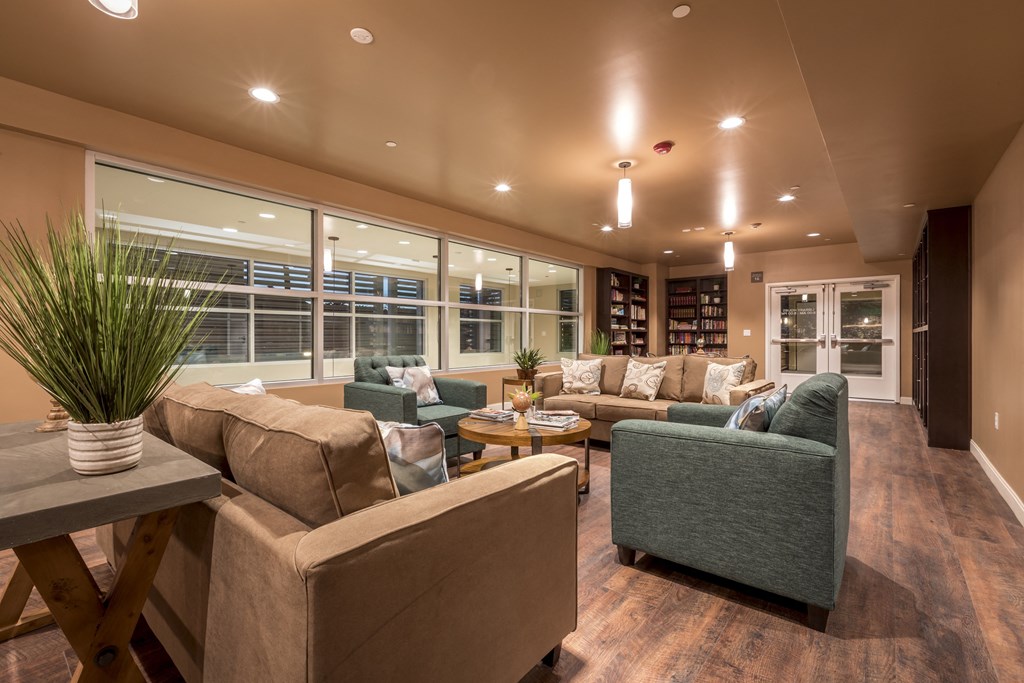 a living room with couches and chairs and a table